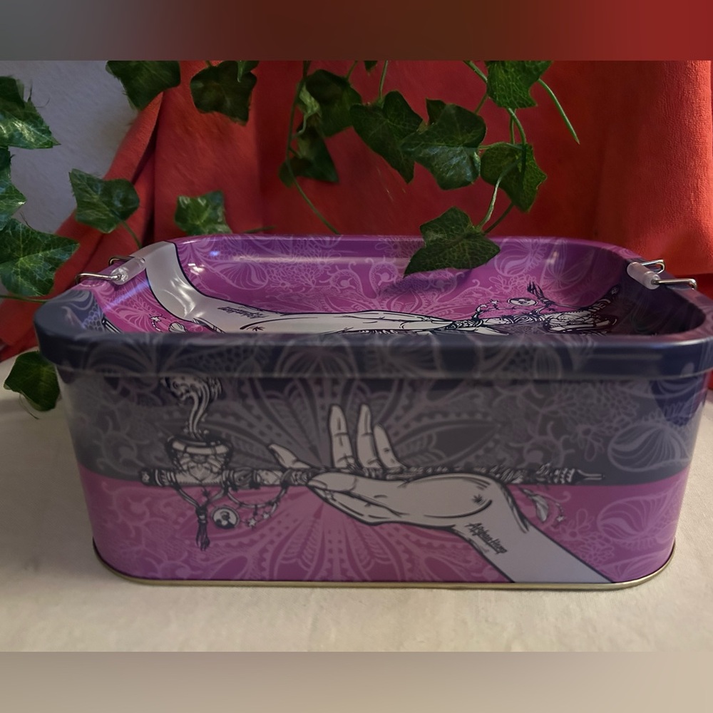 Lovely purple tin storage box with lid. Like new.